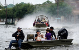 People are rescued from flood waters from Hurricane Harvey on an air boat in Dickinson, Texas August 27, 2017